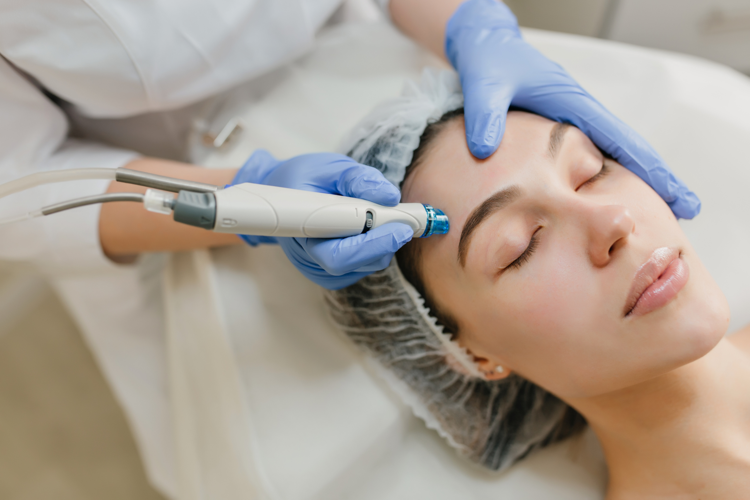 Closeup portrait of beautiful woman during cosmetology therapy in beauty salon. Professional dermatology procedures, lifting, rejuvenation, modern devices, healthcare